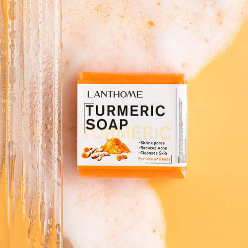 LANTHOME TURMERIC SOAP bar on a bubbly background, promoting skin clarity and acne reduction for face and body.
