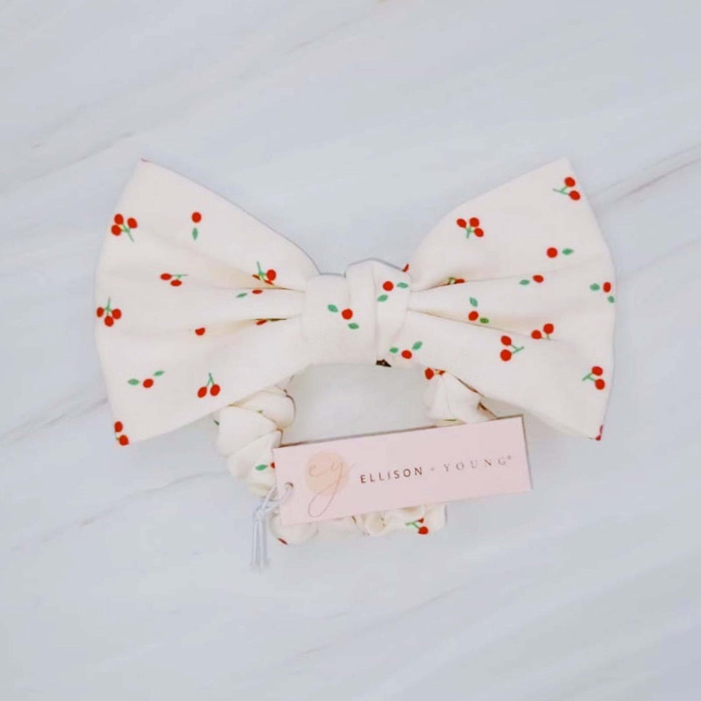 Cherry Lovely Bow Tie Hair Scrunch with cherry print and charming bow tie detail.