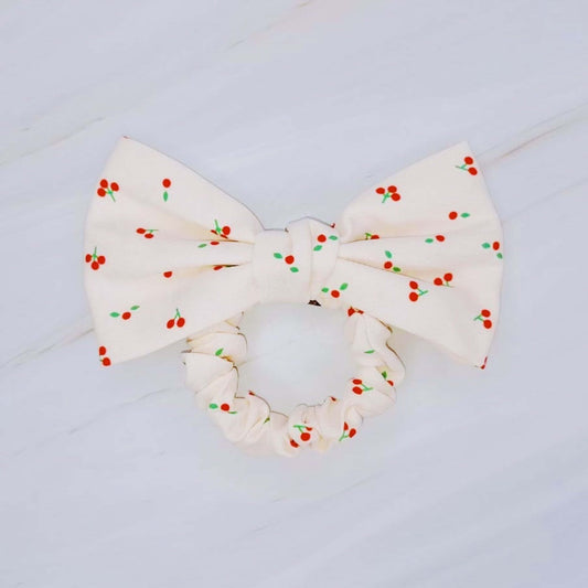 Cherry Lovely Bow Tie Hair Scrunch featuring a playful cherry print and charming bow tie design.