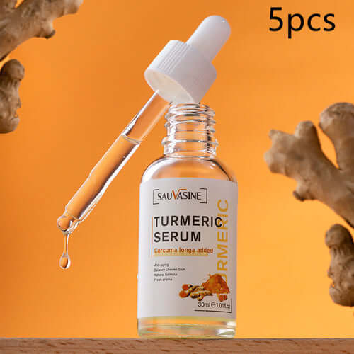 GlowRoot™ – 5-Piece Turmeric Skincare Kit for Radiant Skin - Turmeric Serum with dropper on orange background.