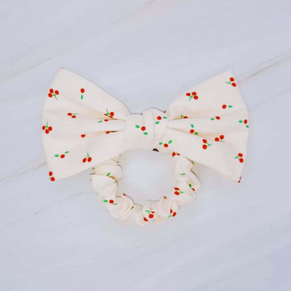 Cherry Lovely Bow Tie Hair Scrunch featuring a playful cherry print and charming bow tie design.
